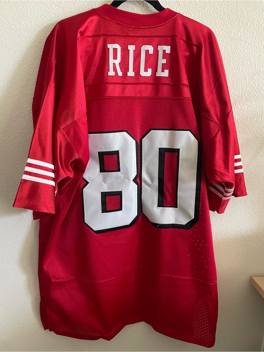 Mitchell & Ness Red Jersey Neckline with White Script Label